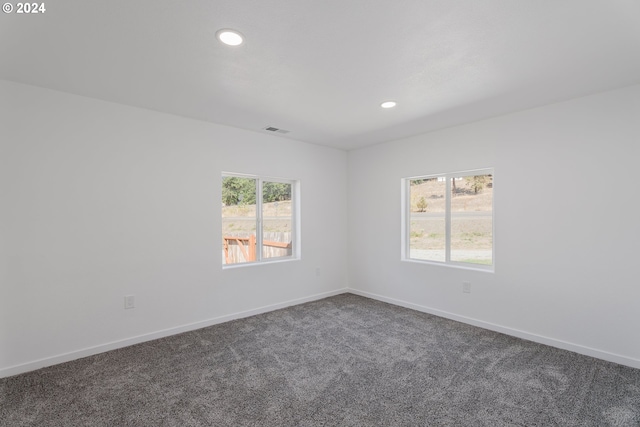 2840 Canyonville Riddle Rd, Riddle, OR 97469 - unfurnished room with baseboards, dark colored carpet, visible vents, and recessed lighting