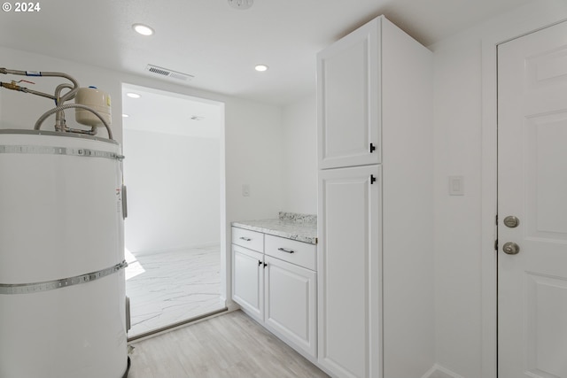 2840 Canyonville Riddle Rd, Riddle, OR 97469 - interior space featuring white cabinets, light wood-type flooring, and visible vents
