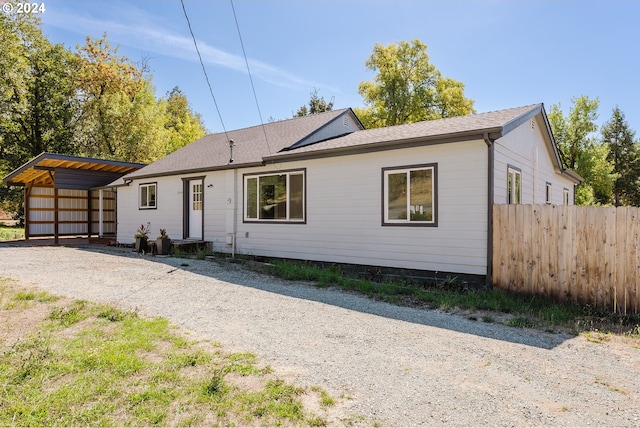 ranch-style house with a carport