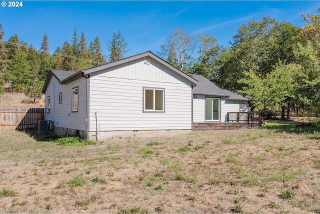 2840 Canyonville Riddle Rd, Riddle, OR 97469 - back of house with cooling unit, a wooden deck, and fence