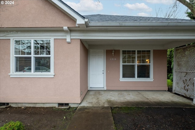 doorway to property featuring a porch