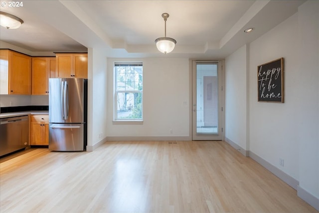 kitchen featuring stainless steel appliances and light hardwood / wood-style floors