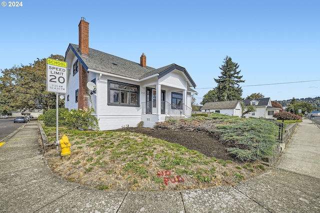 234 Loves Ave, Woodland, WA 98674 - bungalow-style home with a chimney and covered porch