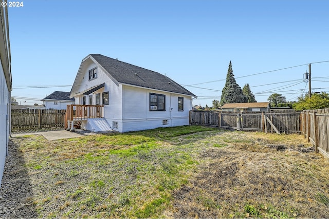 234 Loves Ave, Woodland, WA 98674 - back of house featuring a lawn and a fenced backyard