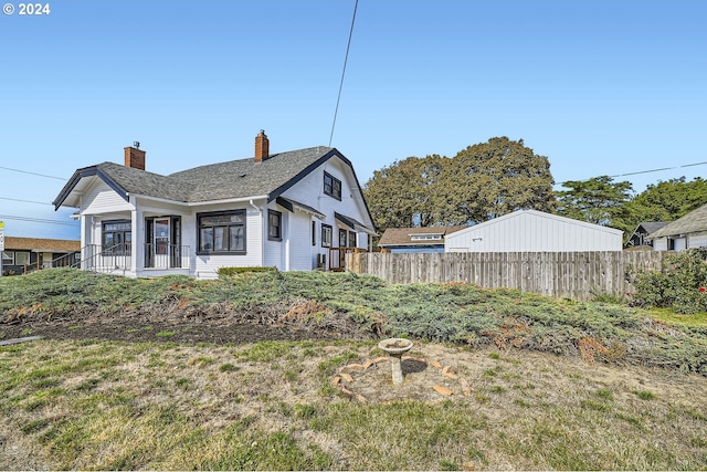 234 Loves Ave, Woodland, WA 98674 - view of property exterior with a chimney and fence