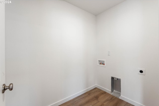 laundry area with hookup for a washing machine, hookup for an electric dryer, and dark hardwood / wood-style flooring