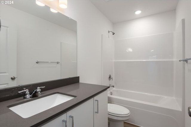 full bathroom featuring shower / bath combination, vanity, and toilet