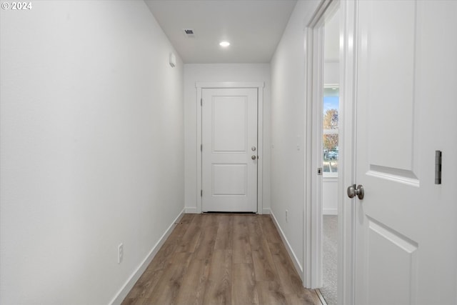 corridor featuring light hardwood / wood-style flooring