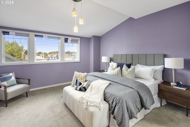 bedroom with vaulted ceiling and carpet