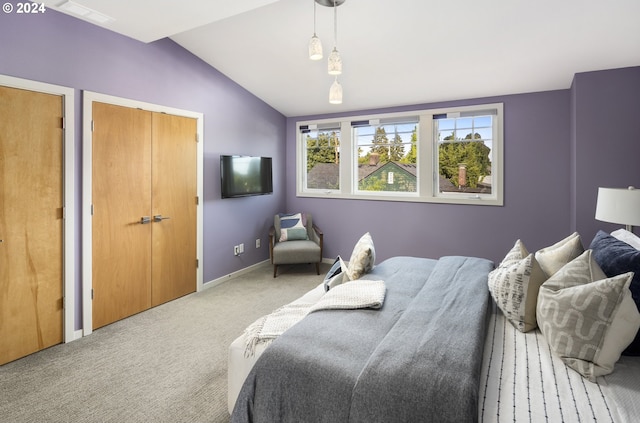 carpeted bedroom featuring vaulted ceiling