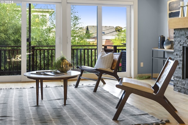 sunroom / solarium featuring a fireplace and plenty of natural light