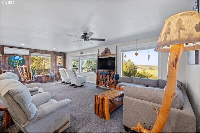 carpeted living room featuring ceiling fan and a wall mounted AC