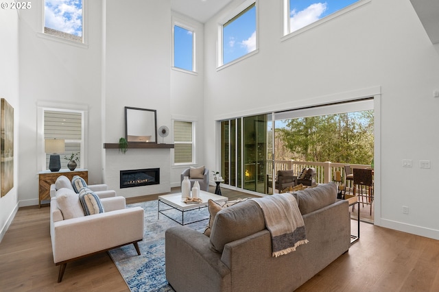 living room featuring wood-type flooring and a wealth of natural light