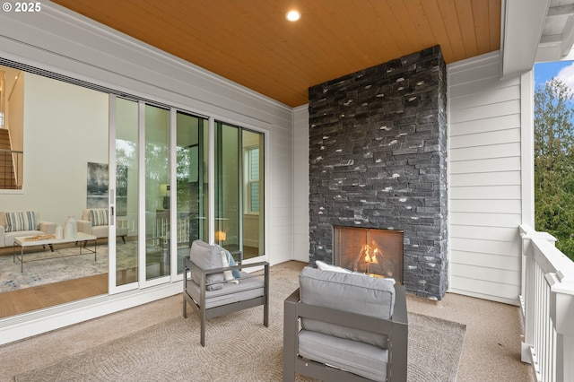 view of patio / terrace with a large fireplace