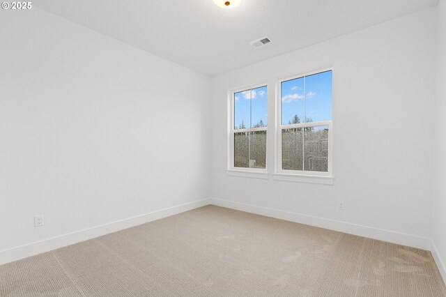 empty room with carpet flooring