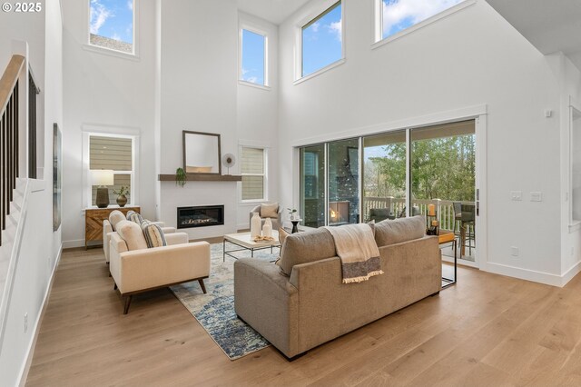 living room with plenty of natural light and light hardwood / wood-style floors