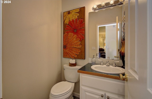 bathroom with vanity and toilet