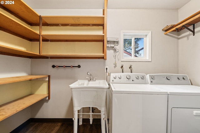 washroom with sink, dark wood-type flooring, and washer and dryer