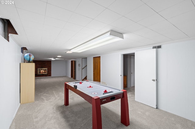 playroom with carpet flooring and a fireplace