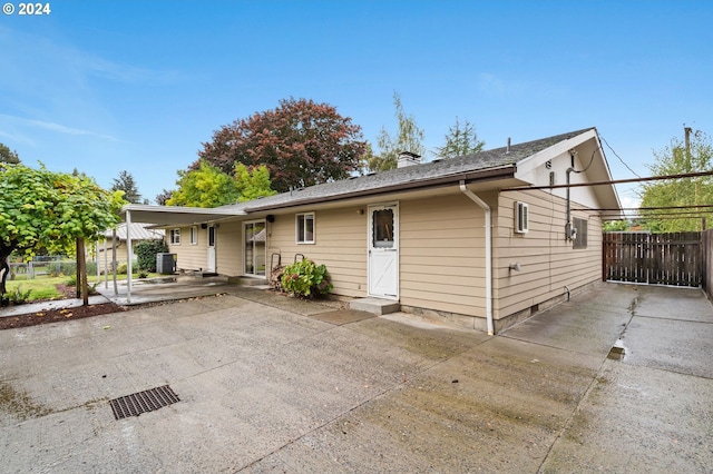 single story home featuring a patio and central AC