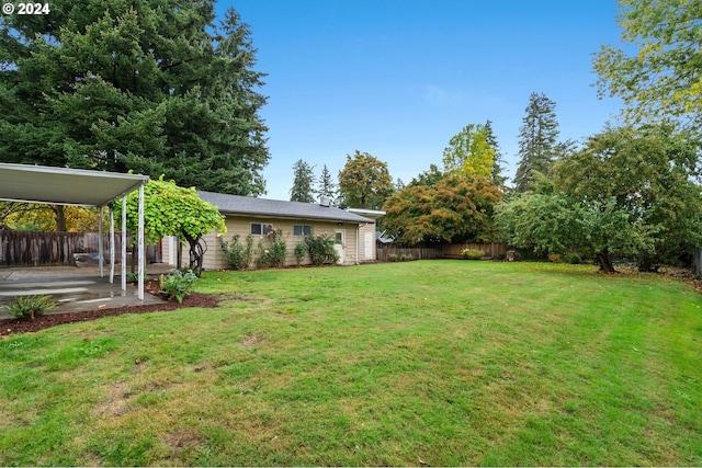 view of yard featuring a patio area and a carport