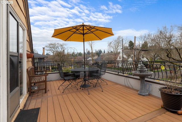 wooden terrace with outdoor dining area