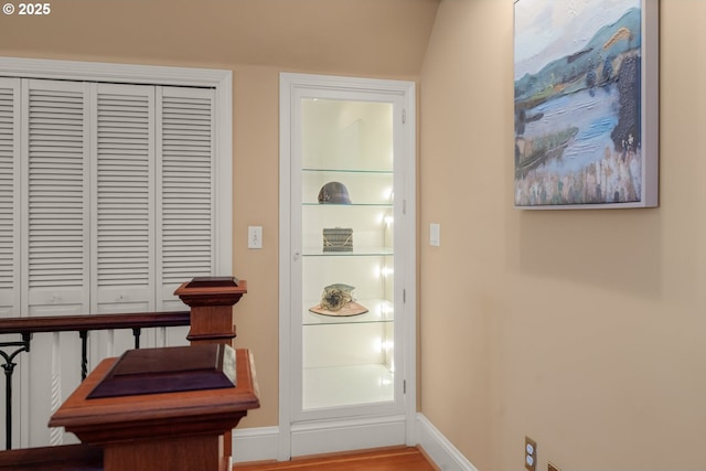 living area featuring baseboards