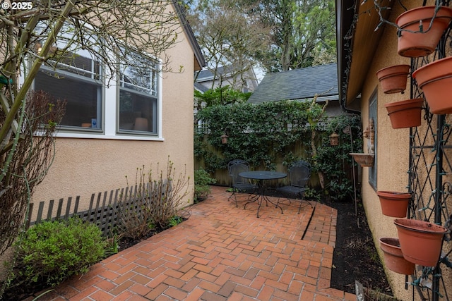 view of patio featuring fence