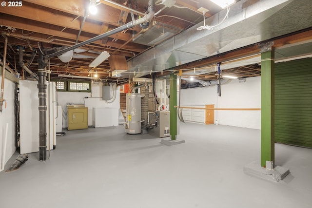 2130 NE Klickitat St, Portland, OR 97212 - basement featuring gas water heater, heating unit, and washer and clothes dryer