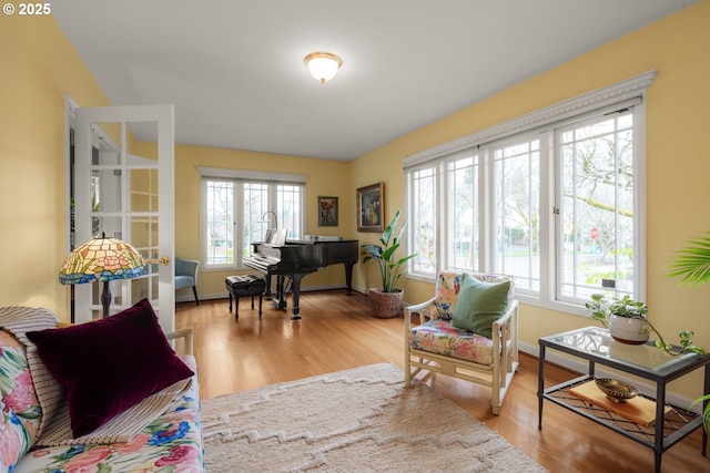 living room with wood finished floors and baseboards