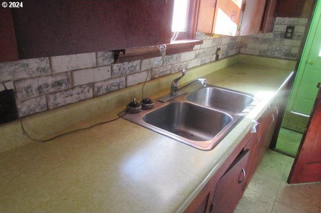 kitchen with sink and tasteful backsplash