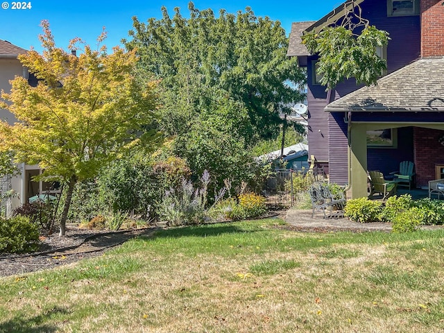 view of yard with a patio area and fence