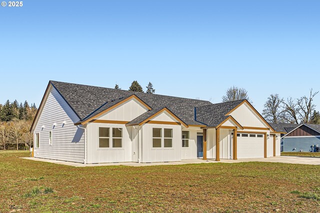 garage featuring a yard