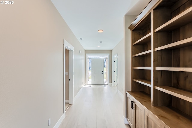 hall with light hardwood / wood-style floors