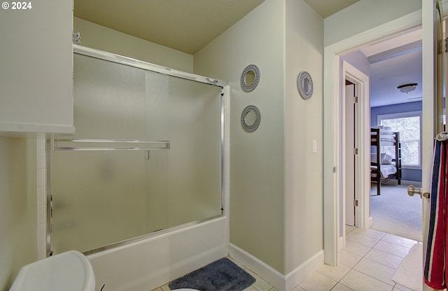 bathroom with tile patterned floors and enclosed tub / shower combo