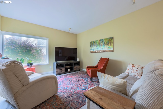 living room featuring baseboards