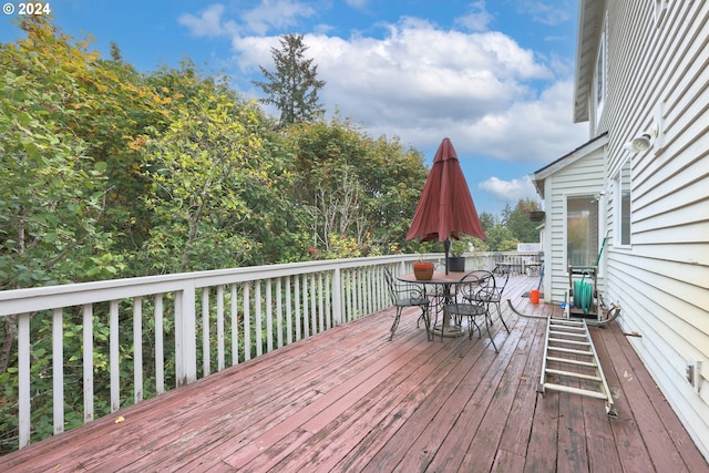 wooden deck with outdoor dining space