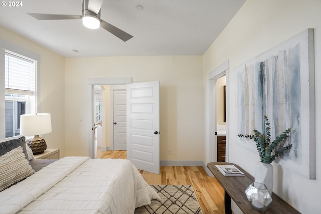 bedroom with light hardwood / wood-style flooring and ceiling fan