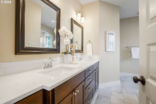 bathroom with tile patterned floors and vanity