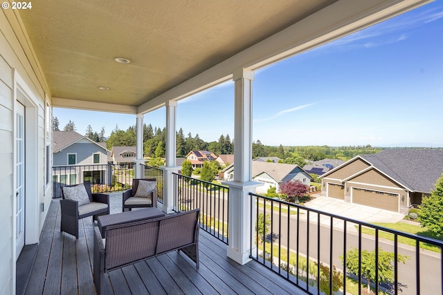 wooden deck featuring a garage