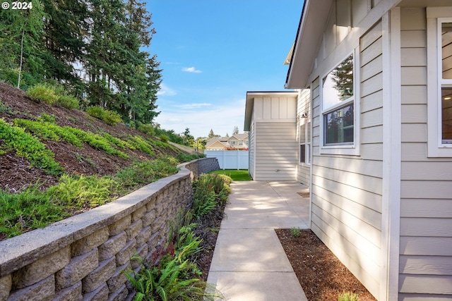 view of property exterior with a patio