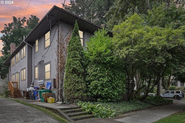 view of property exterior at dusk