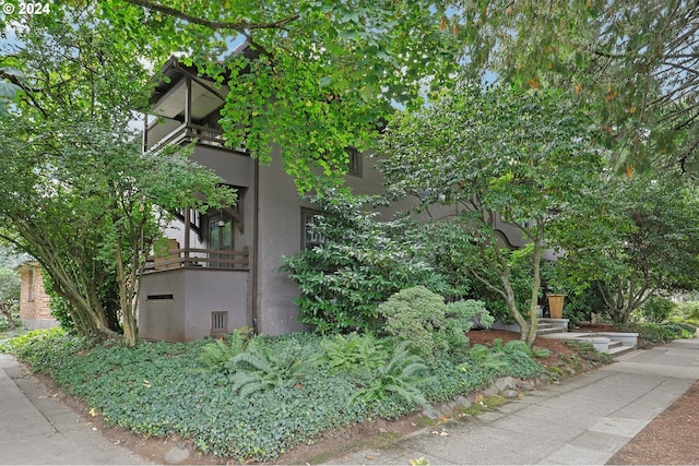 view of property exterior featuring a balcony