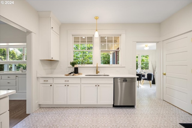 kitchen with stainless steel dishwasher, sink, and plenty of natural light