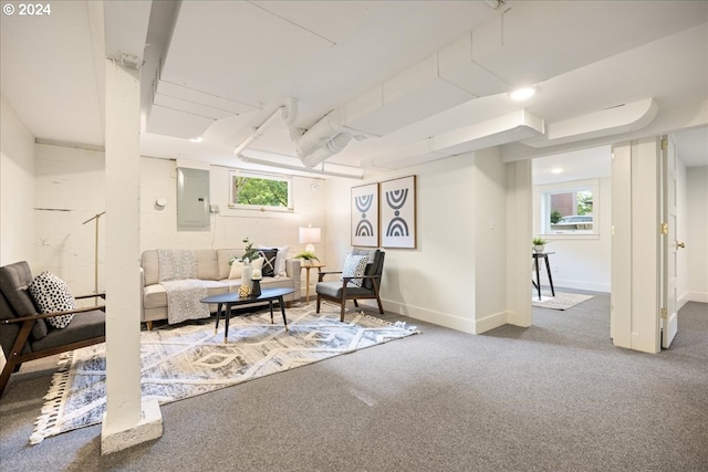 living room with a wealth of natural light, electric panel, and carpet floors