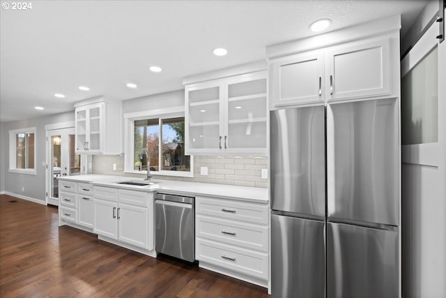 kitchen with sink, white cabinetry, and stainless steel appliances