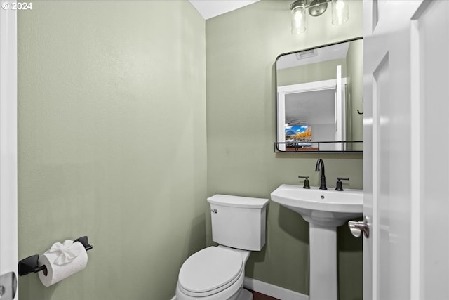 bathroom with toilet and sink