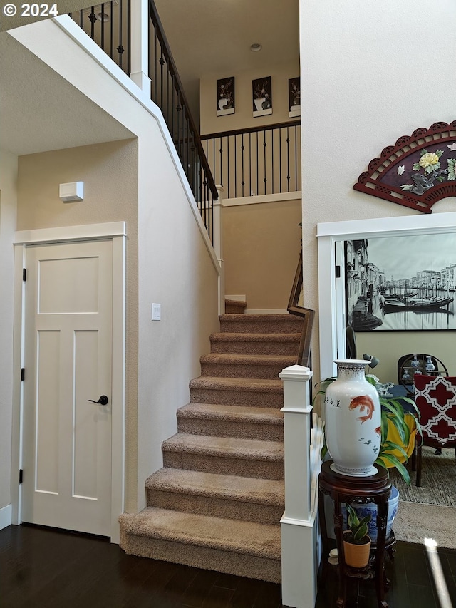 stairs with hardwood / wood-style floors