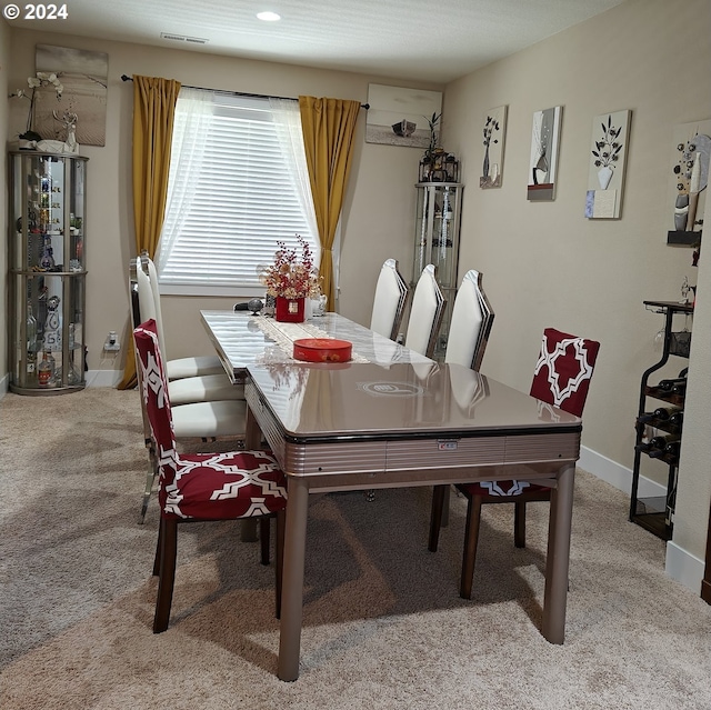 view of carpeted dining area