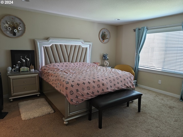 bedroom with light colored carpet